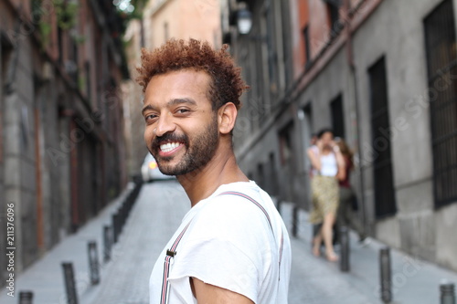 Brazilian man smiling on the street 