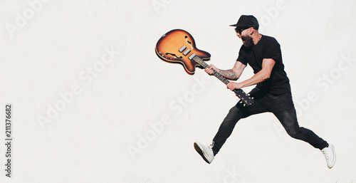 Photography Guitar player singing outside