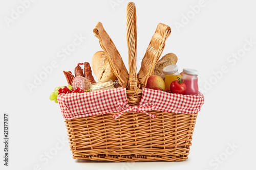Obraz na płótnie Delicious summer picnic food in a wicker hamper