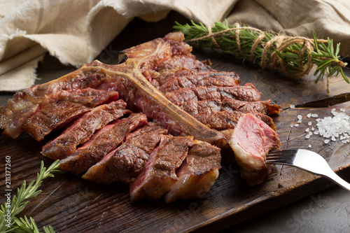 Bilde på lerret porterhouse steak grilled sliced on a piece of wood Board