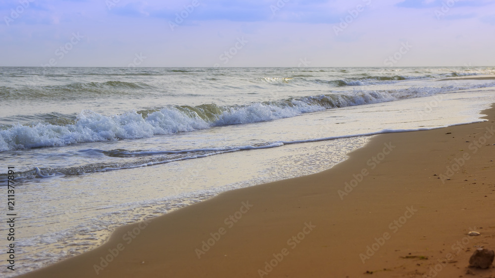 beautiful yellow sandy beach near the blue sea