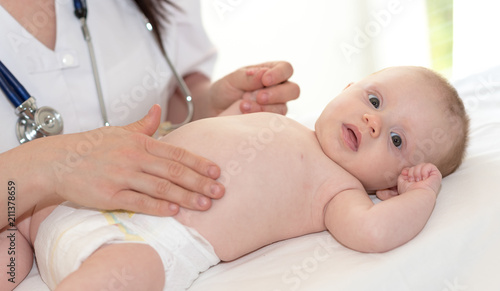 Pediatrician examining baby
