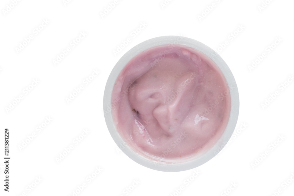Yogurt in plastic cup - Top view photo of blue berry yoghurt isolated on white background Yogurt in plastic cup - Top view photo of blue berry yoghurt isolated on white background