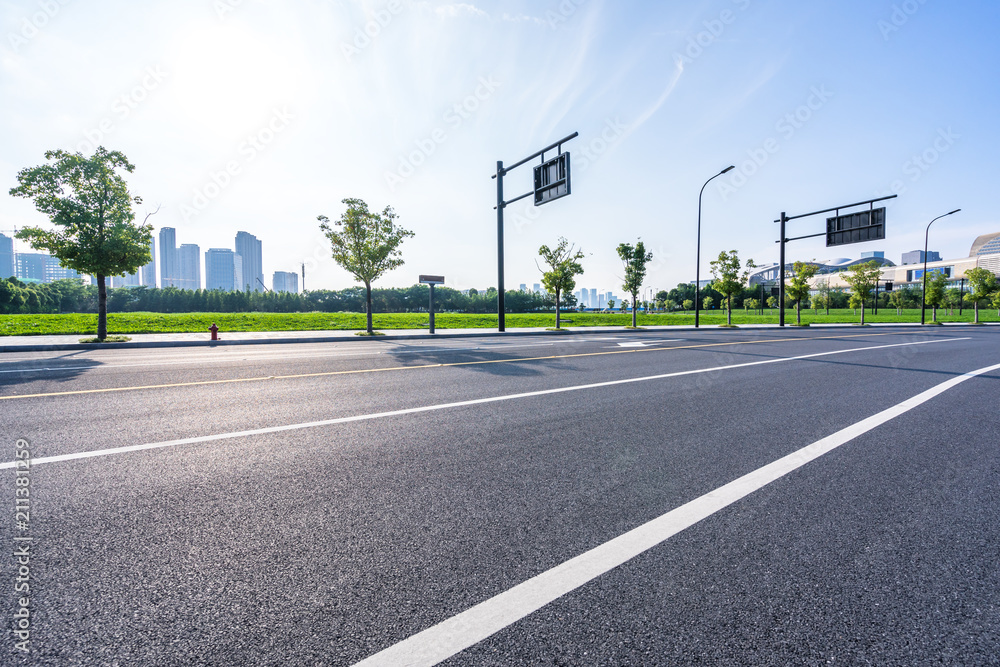 empty asphalt road with modern building in urban empty asphalt road with modern building in urban
