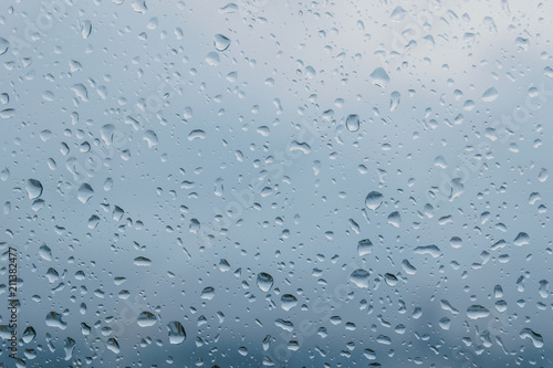 Water drops on glass - abstract background.