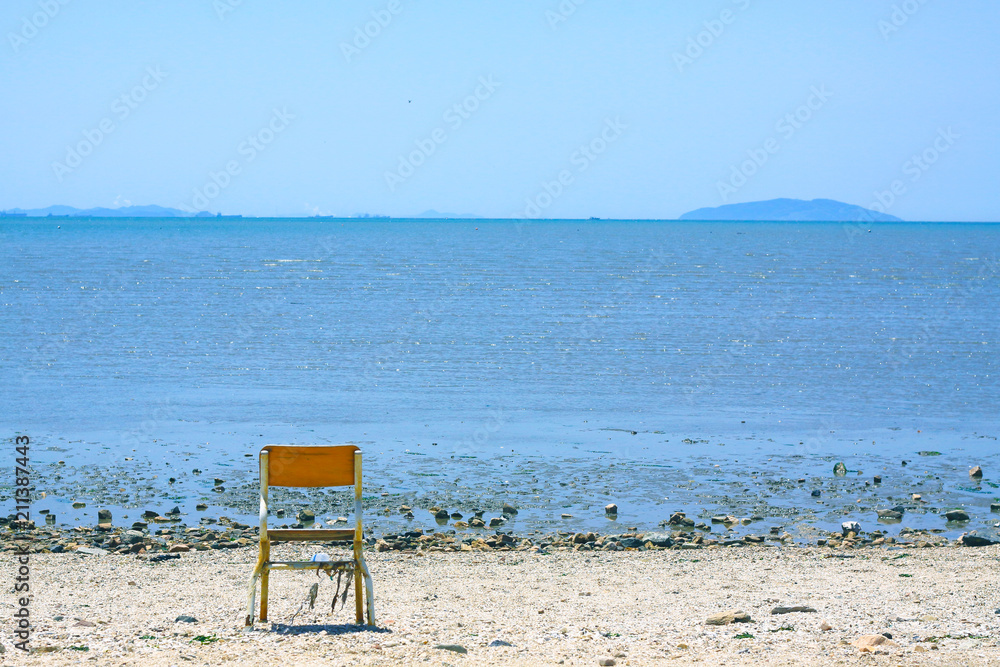 A chair in the sand beach
