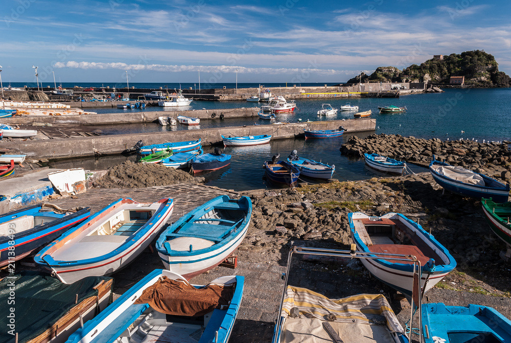 Small port in Aci Trezza (Sicily, Italy); the island Lachea in the background