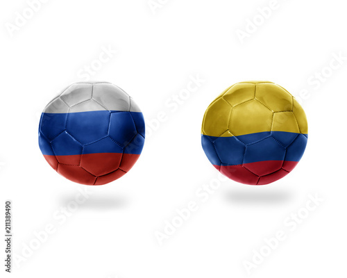 football balls with national flags of colombia and russia.