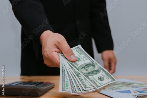 man counting money at the table