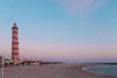Lighthouse and beach at dusk