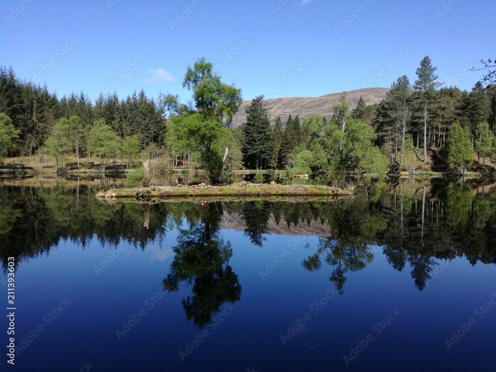 calm lake in the scottish highlands