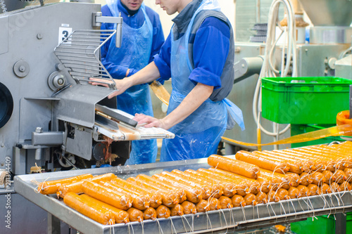 Sausage. Sausage production line. Process of sausage manufacturing. Industrial manufacturing of sausages. Meat shop photo