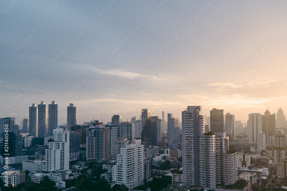 Bangkok cityscape after the rain in the evening with sun going down.