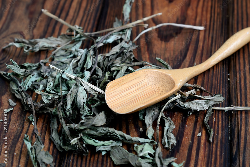 Plant spearmint for medical purposes and a wooden spoon
