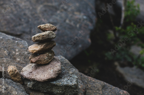 Canvas Print Image of spiritual stones pyramid in the dark forest