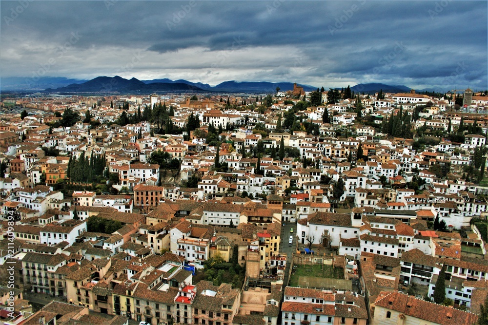 Panoramic cityscape - view looking out over red rooftops in Granada, Spain