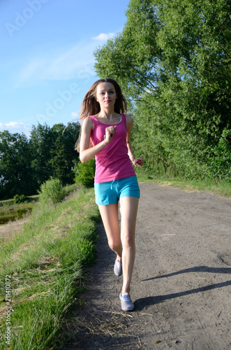 Petite female running in the forest