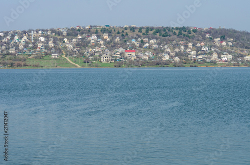 Settlement on the shore of the pond