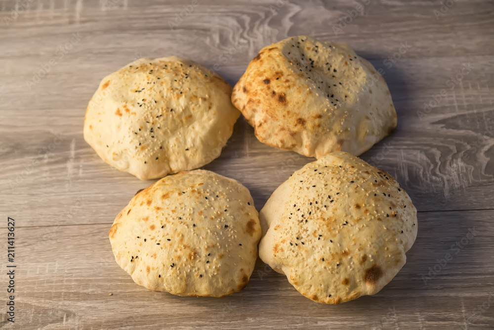 local bread on the wooden background in Turkey. local bread on the wooden background in Turkey.