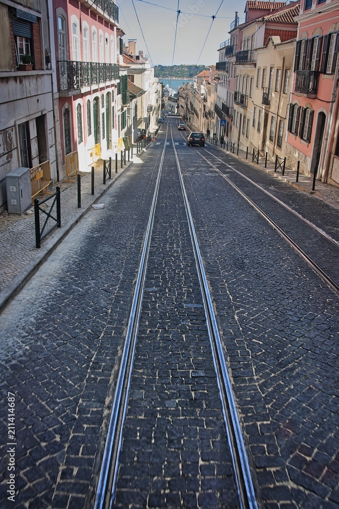 Lisbon high slope street with rail tracks