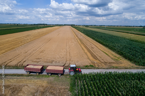 Aerial view of tractor with trailers on rural road