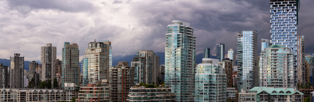 Panoramic view of Downtown City Buildings during a vibrant evening. Taken in Vancouver, British Columbia, Canada. Panoramic view of Downtown City Buildings during a vibrant evening. Taken in Vancouver, British Columbia, Canada.