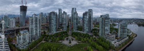 Aerial view of high rise buildings in Downtown City during a cloudy sunrise. Taken in Vancouver, BC, Canada.