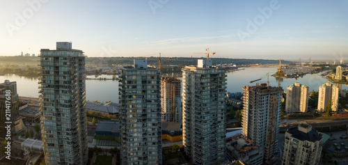 Aerial view of Residential Buildings in the city during a vibrant sunrise. Taken in New Westminster, Greater Vancouver, British Columbia, Canada.