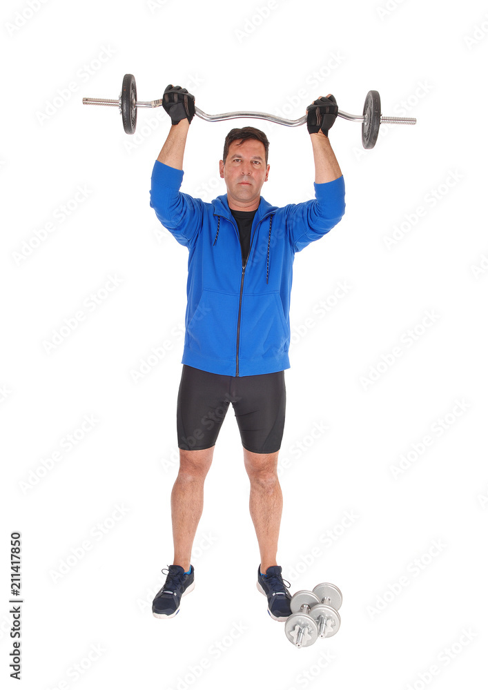 Obraz premium Tall man lifting the weight over his head