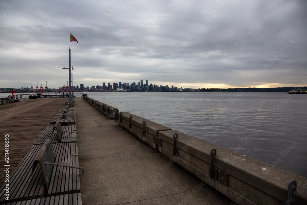 North Vancouver, British Columbia, Canada - June 5, 2018: Downtown City viewed from Lonsdale during a cloudy sunset.