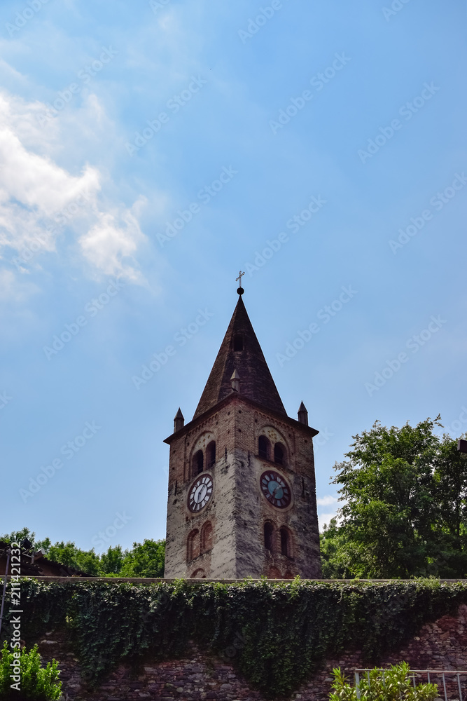 Geometric set of the Church of Santa Maria Maggiore in a village near Turin, historical monument photographed at the passage of clouds. photo taken in Avigliana, Italy.