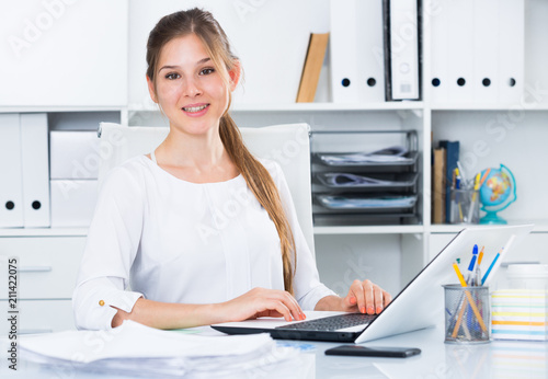 Young business woman at workplace