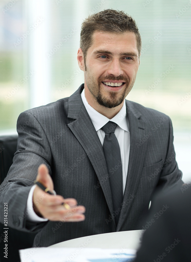 closeup.Manager and client discussing the terms of the contract in the office.