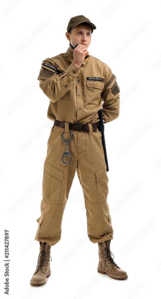 Male security guard using portable radio transmitter on white background Male security guard using portable radio transmitter on white background