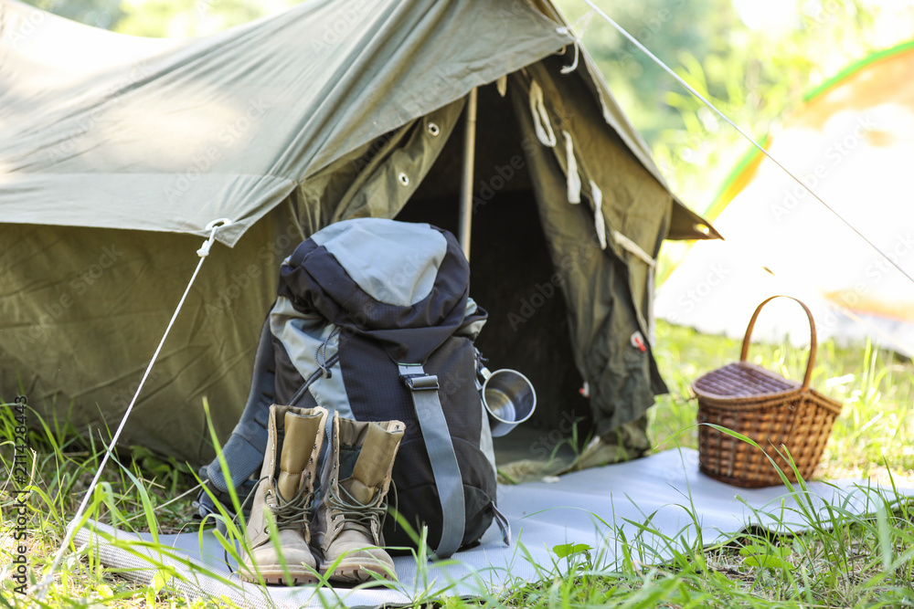 Traveling gear near tent outdoors. Summer camp