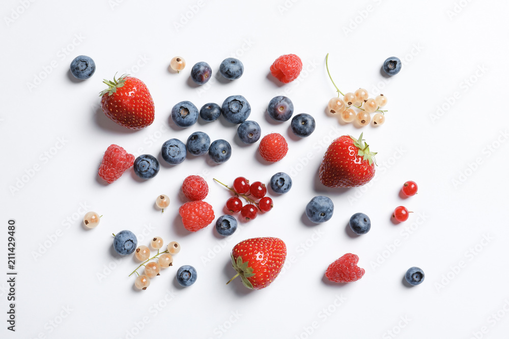 Raspberries and different berries on white background Raspberries and different berries on white background