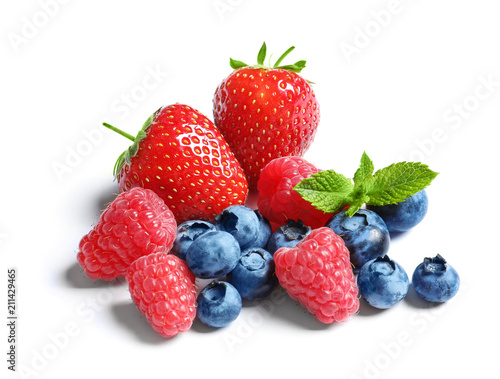 Raspberries  strawberries and blueberries on white background