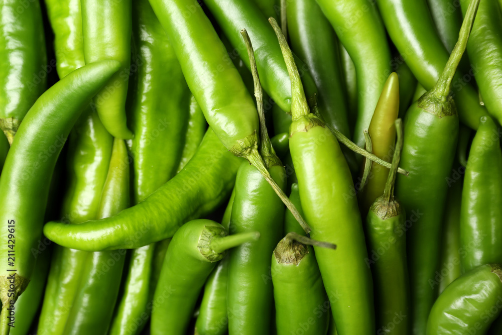 Ripe hot chili peppers as background, closeup Ripe hot chili peppers as background, closeup