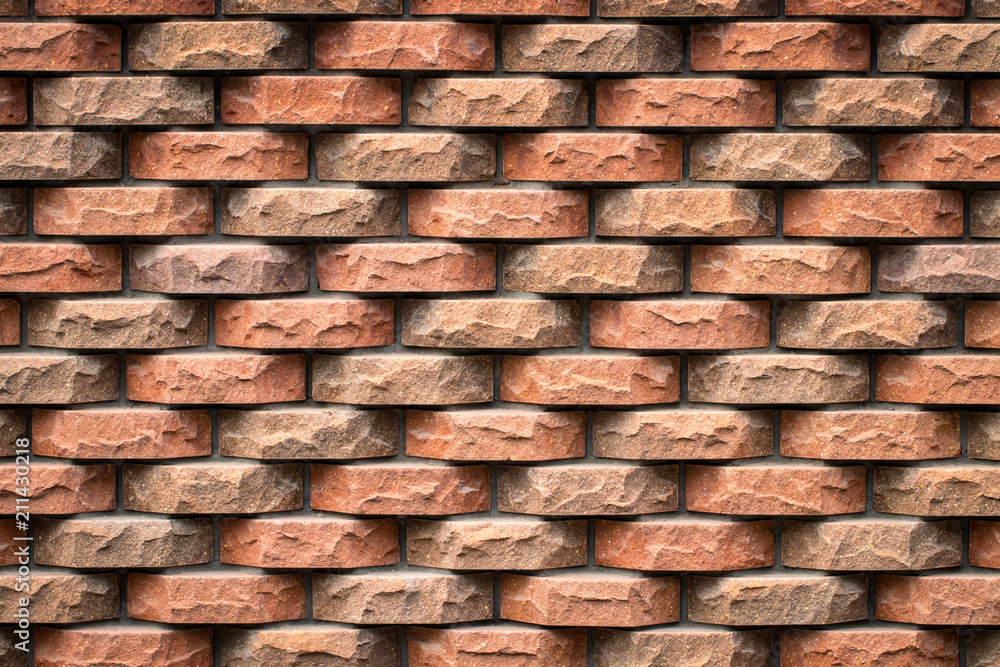 Beautiful accurate textured brick wall on a bright sunny day. Brick background