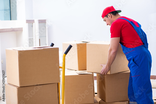 Contractor worker moving boxes during office move