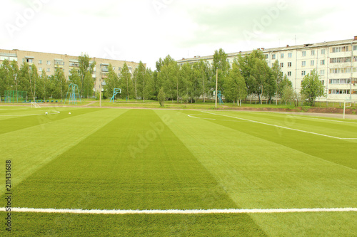 Green artificial football field. The school stadium. Background. © far700