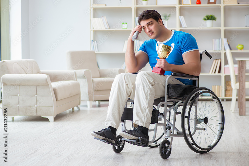 Disabled man watching sports on tv Disabled man watching sports on tv
