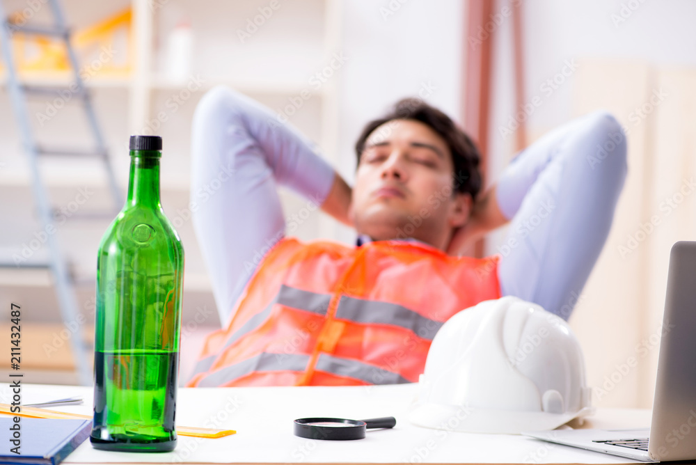 Drunk engineer working in the workshop Drunk engineer working in the workshop