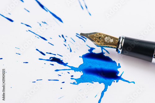 Fountain pen and fountain pen ink making a spatter on white paper