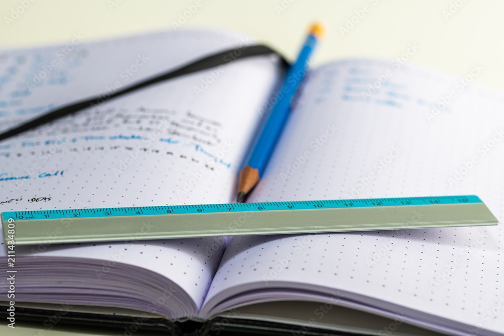 Notebook with writing, ruler, pencil, fountain pen Notebook with writing, ruler, pencil, fountain pen