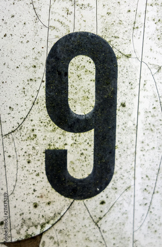 Written Wording in Distressed State Typography Found Number Nine 9