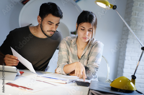 Man and Woman Worried For Taxes And Family Budget photo