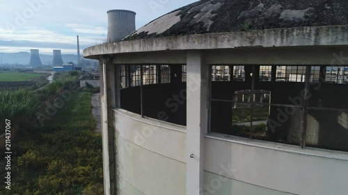 Drone flight over massive abandoned Communist era industrial complex in central Albania