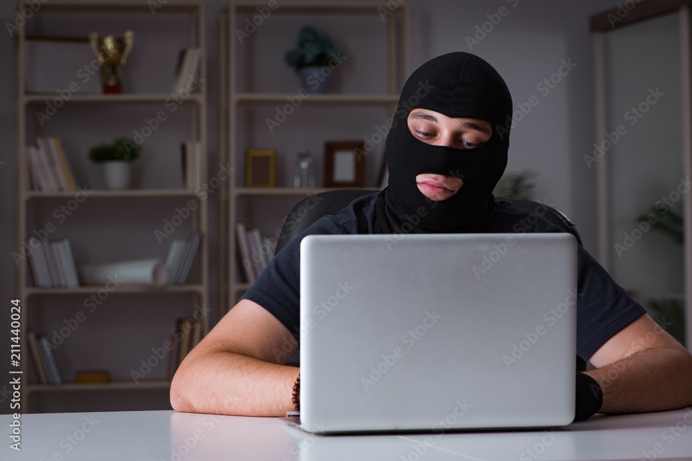 Hacker hacking computer late at night Hacker hacking computer late at night