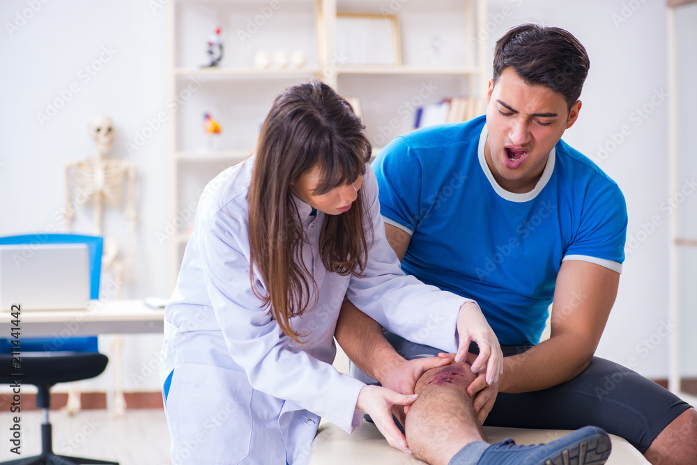 Fototapeta premium Patient visiting doctor after sustaining sports injury